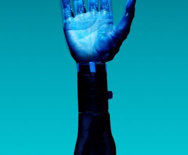 alt="Free Prosthetic Arm on Blue Background Stock Photo"