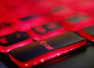 a close up of a red and black keyboard